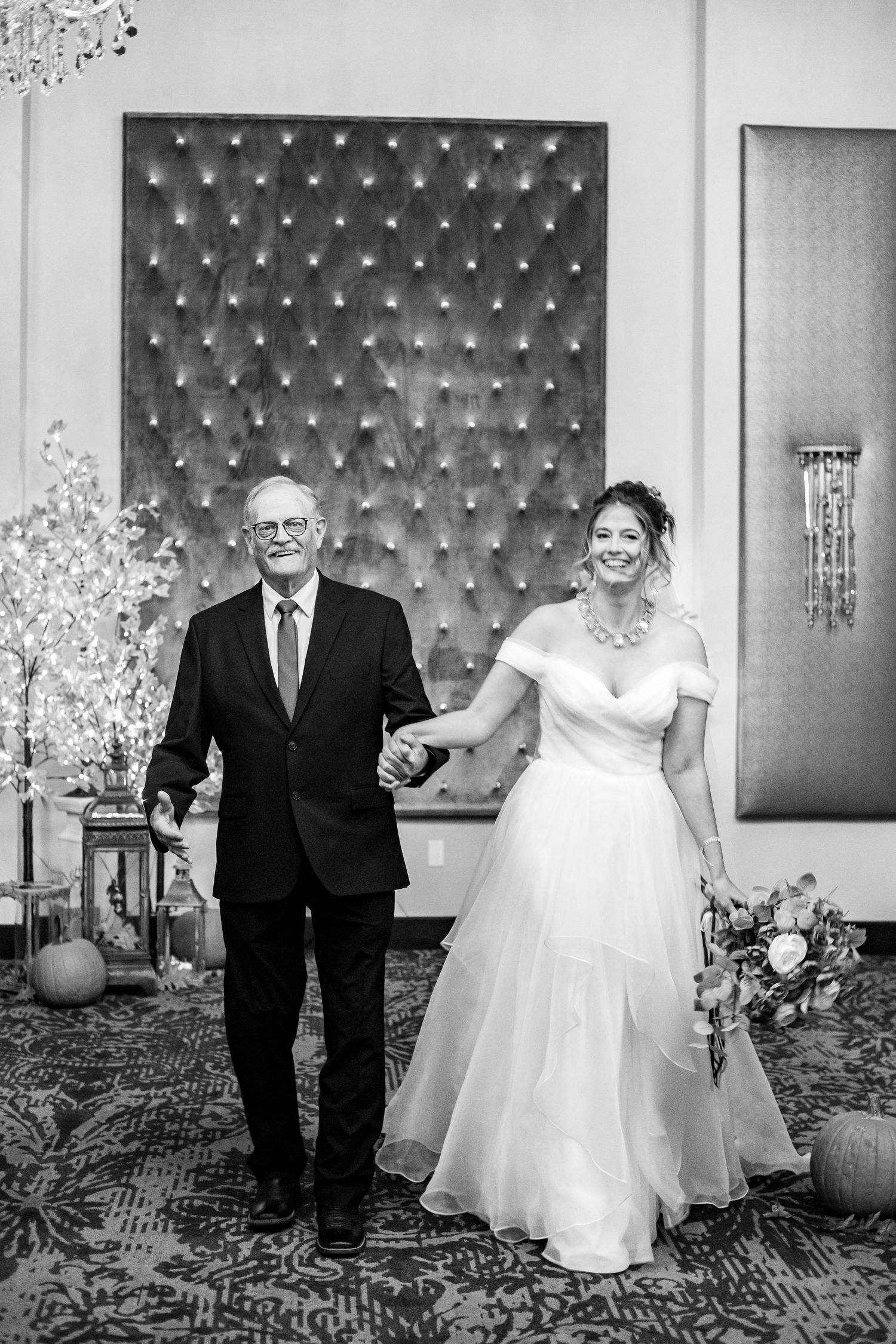 A candid shot of father of bride and bride in black and white for a wedding in Nebraska