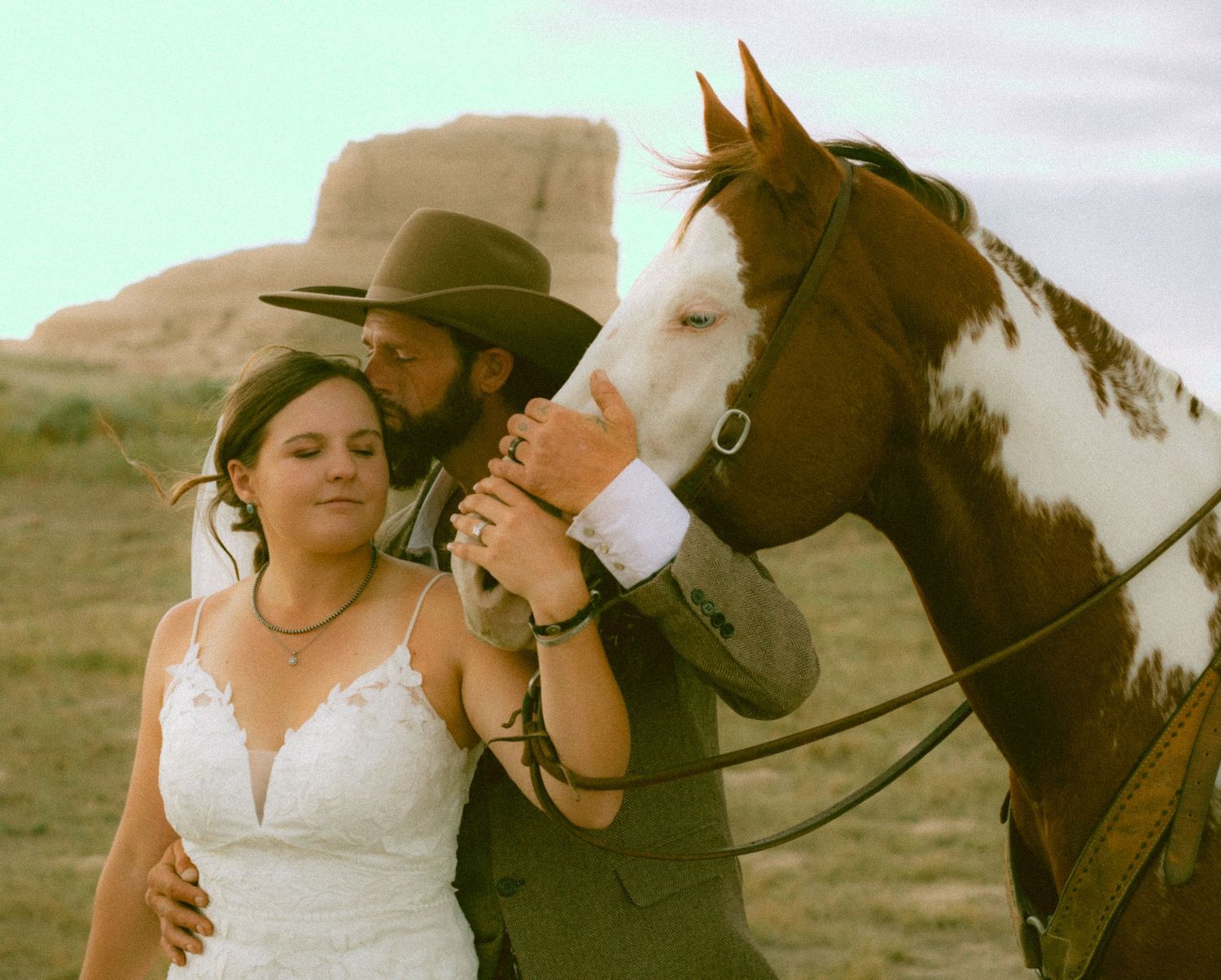 Romantic western-themed photo series with horses in a rustic outdoor setting in Bridgeport Nebraska.