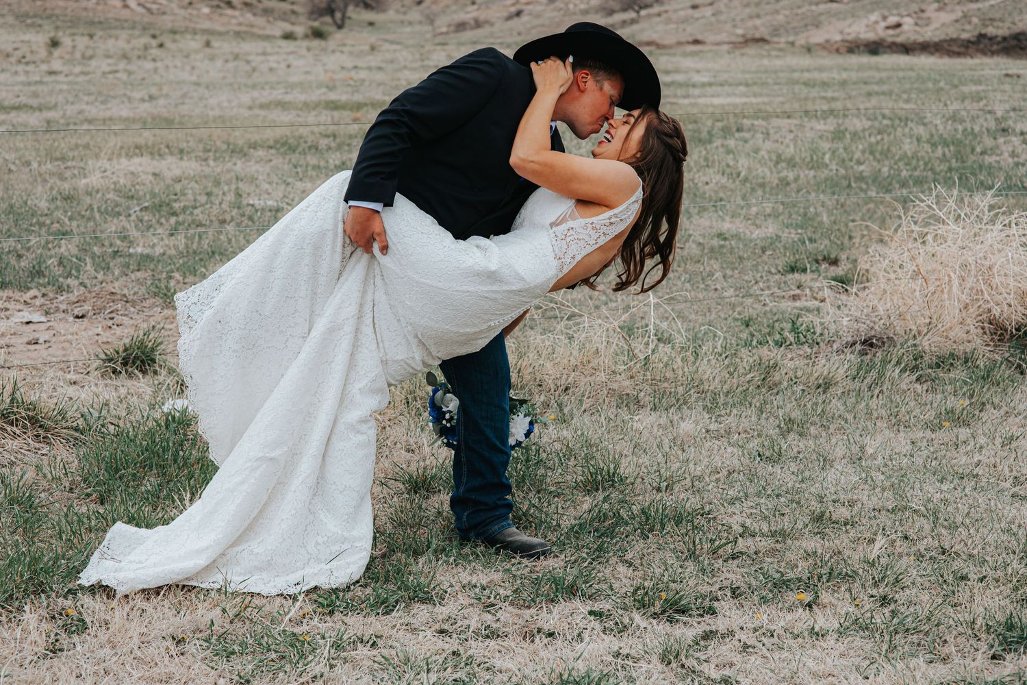 Romantic couple poses together on a rustic desert landscape in Sidney Nebraska.