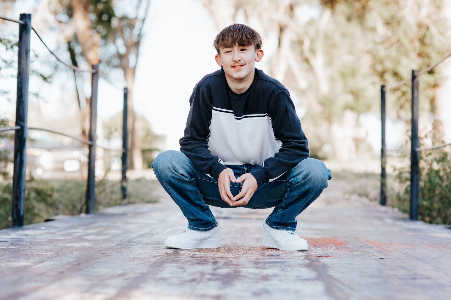 young adult senior portrait photographed outdoors during golden hour in western nebraska