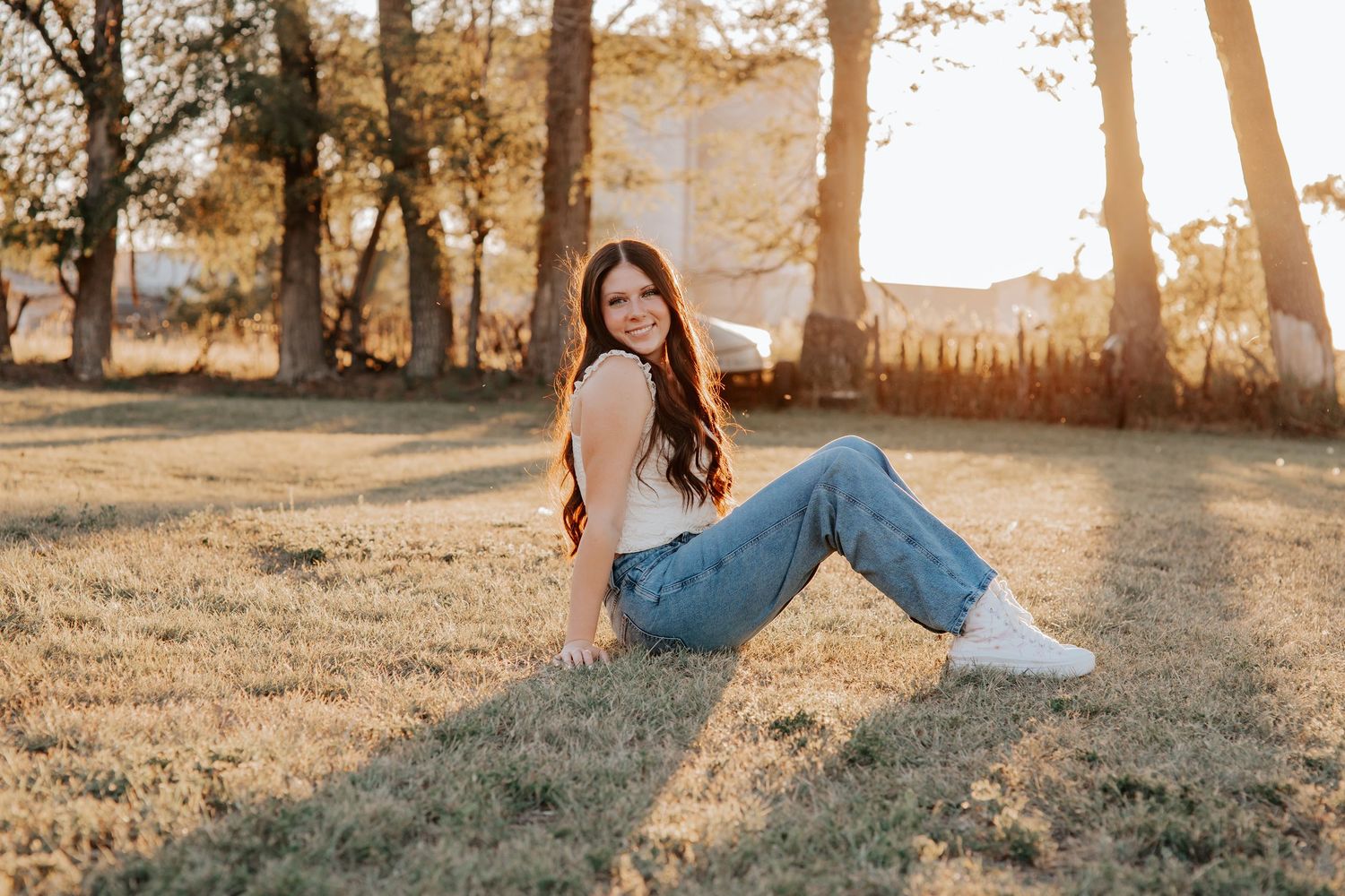 senior portrait capturing quiet confidence in an open rural landscape