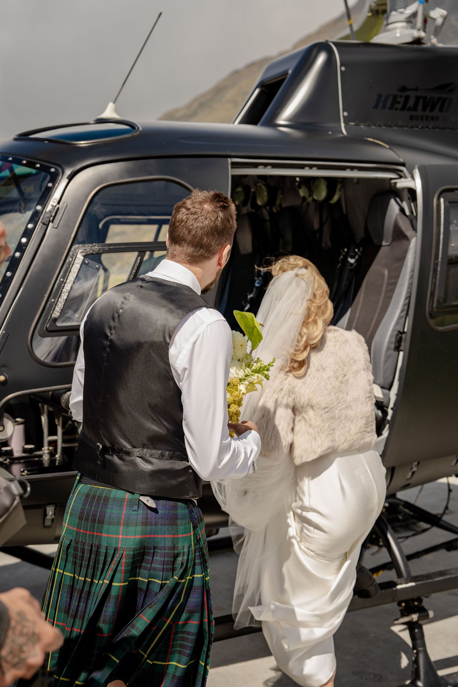 Bride and Groom getting on to helicopter. Queenstown New Zealand.