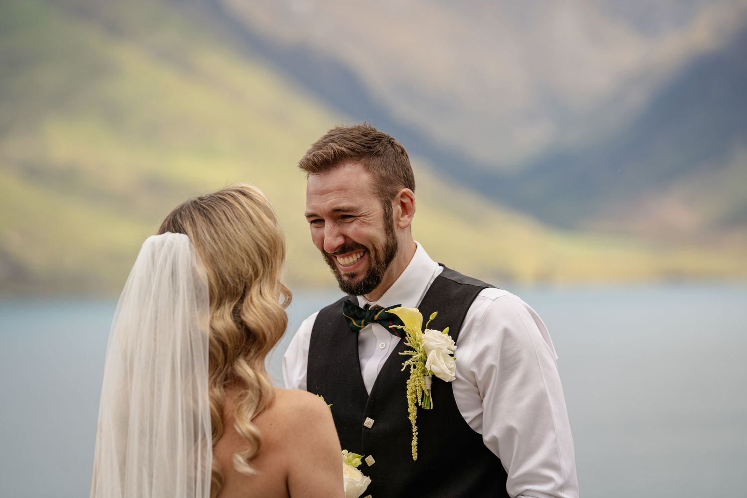 Groom smiling at bride in Queenstown elopement.