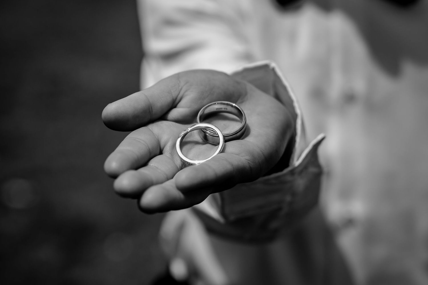 Child holding wedding rings at Queenstown elopement ceremony.