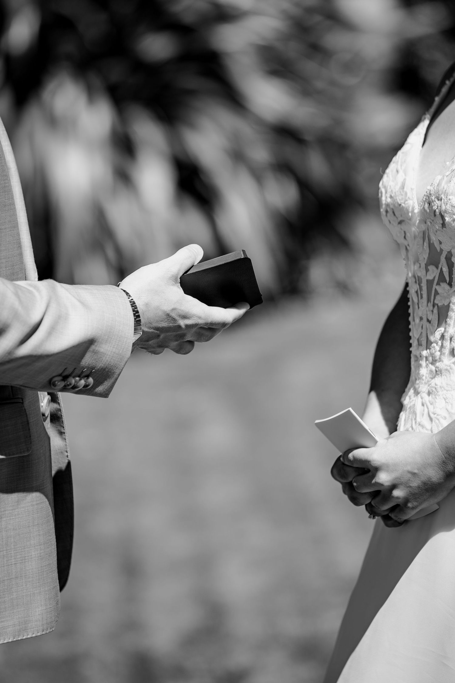 Couple holding vow booklets for Central Otago wedding.
