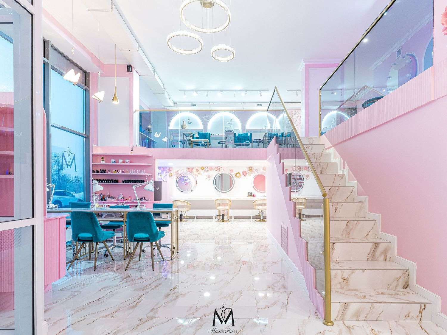 Modern office space with pink and blue decor featuring white marble floors and geometric design elements.