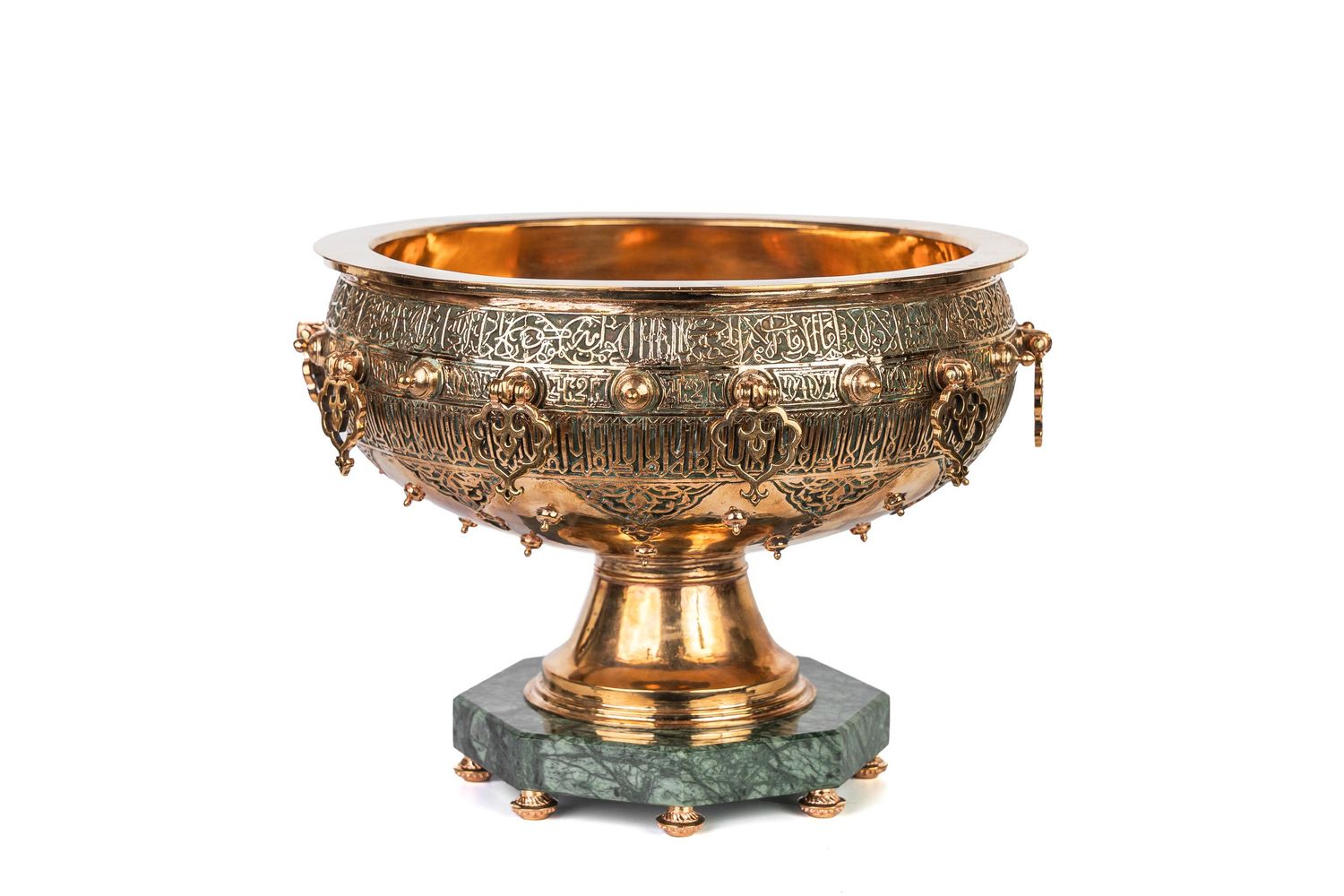 Antique brass decorative bowl with ornate relief details and pedestal base.