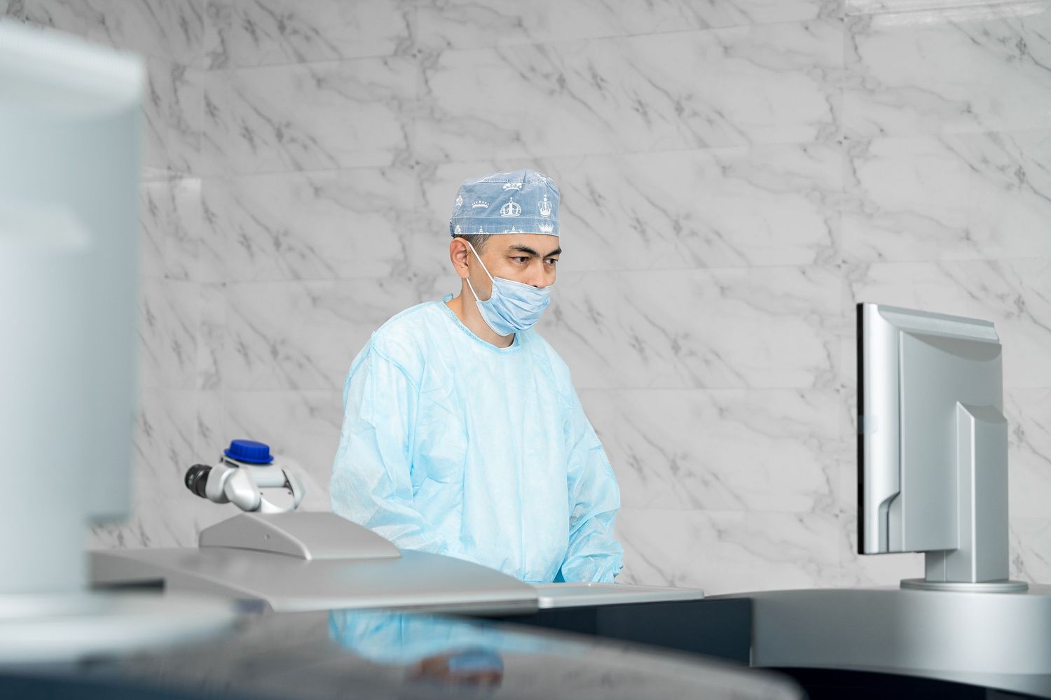 Healthcare specialists working with advanced medical technology in clinical environment.