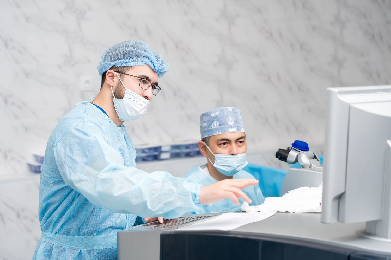 Medical professionals collaborating during surgical procedure in modern healthcare facility.