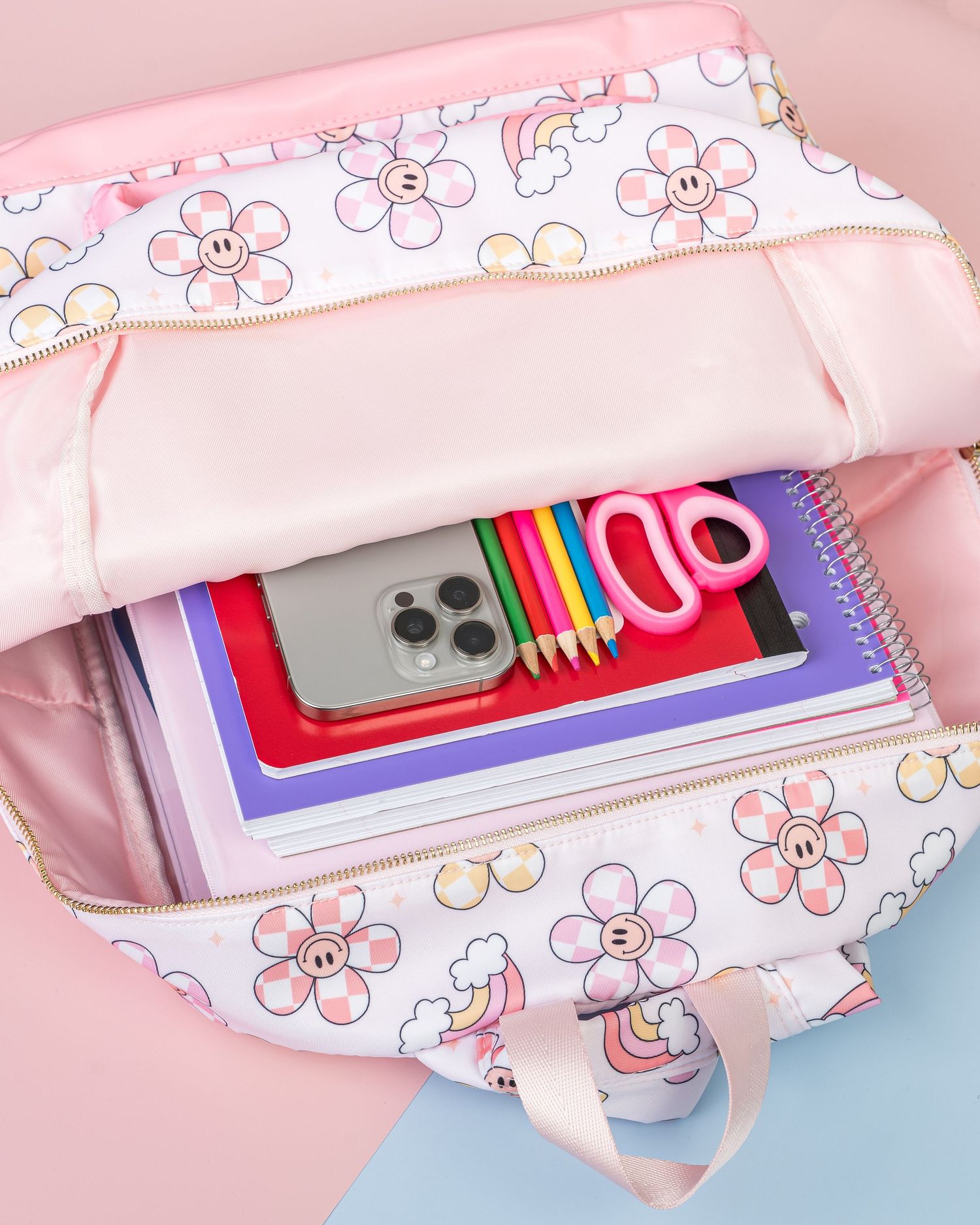 Pink floral pattern pencil pouch filled with school supplies shown from multiple angles.