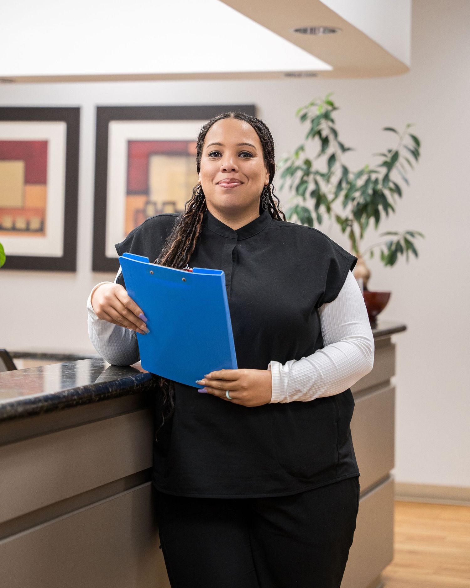 Healthcare professional reviews medical charts in a modern medical office.