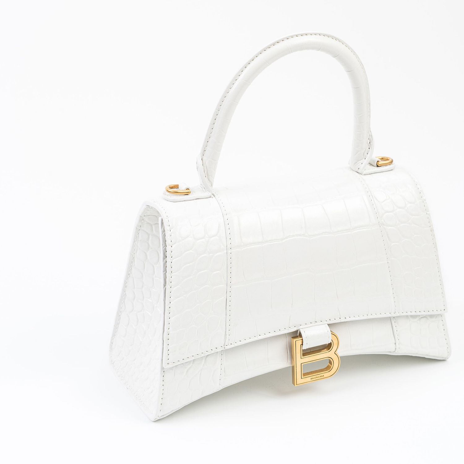 White leather handbag with gold B-logo clasp detail shown from different angles.