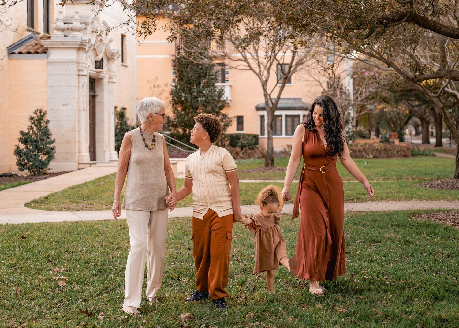 Outdoor family photography captured among the beautiful gardens and architecture of Rollins College in Winter Park Florida
