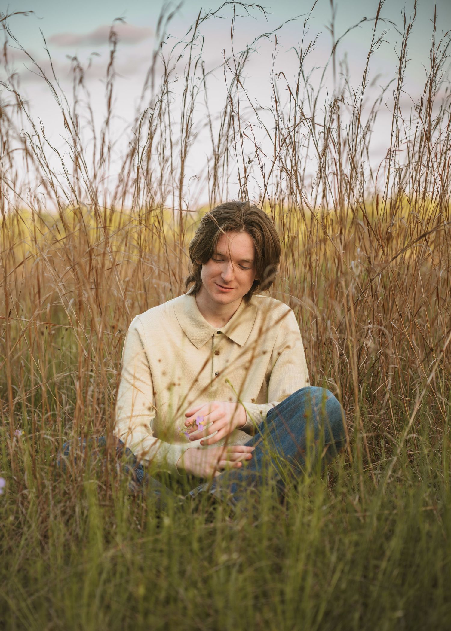 Golden hour graduation portraits captured in the open fields of Lake Runnymede Conservation Area.