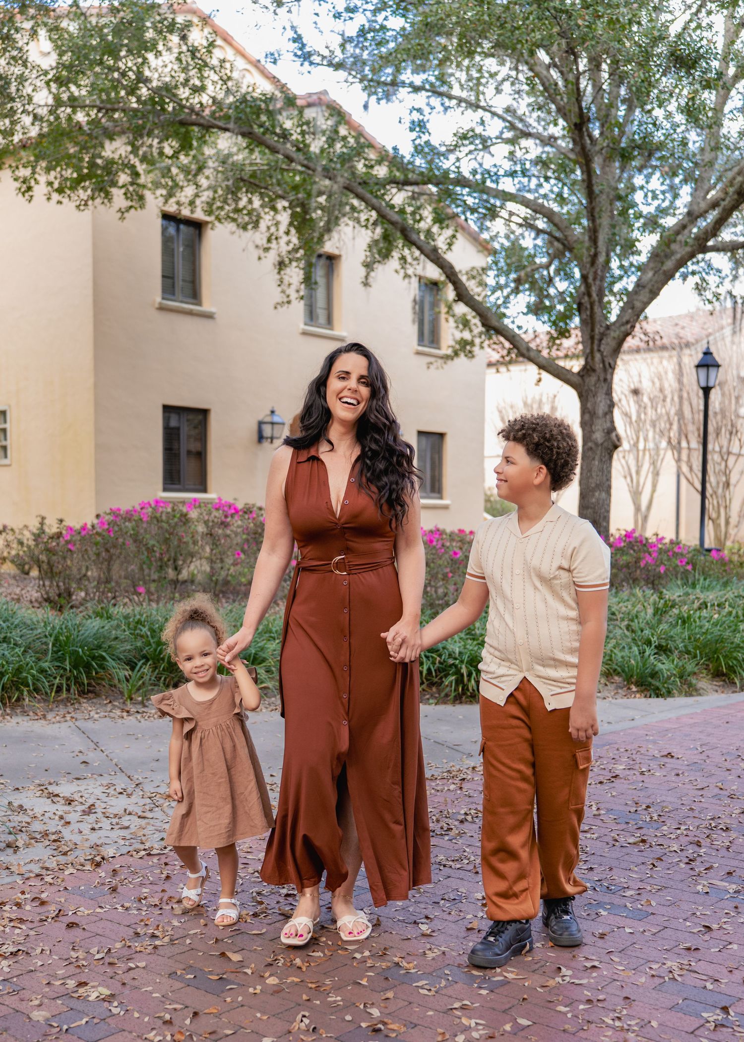 Genuine moments between a mother and her children during a family photography session at Rollins College in Winter Park Florida