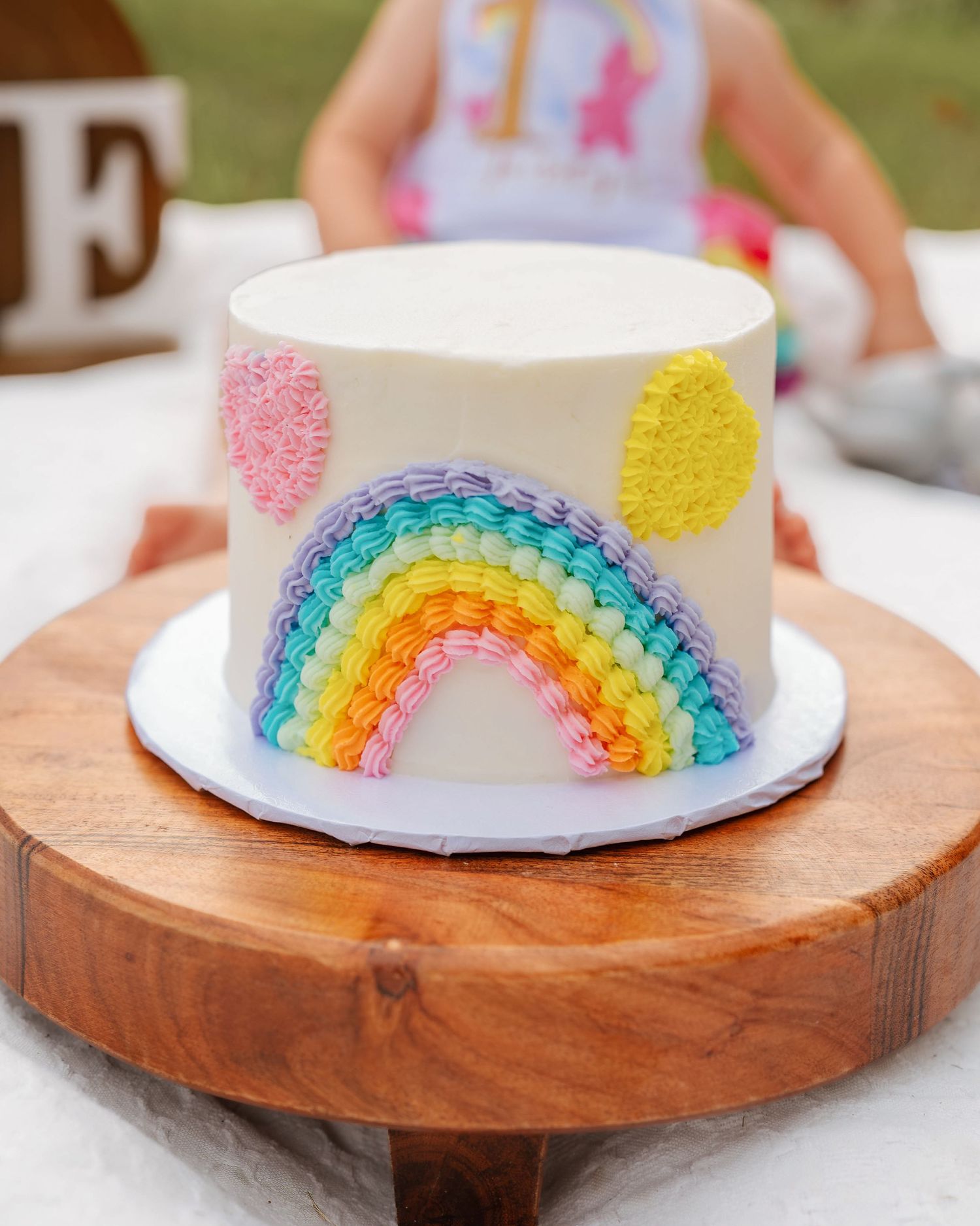 First birthday cake session celebrating girl's milestone in St. Cloud, Florida by family photographer