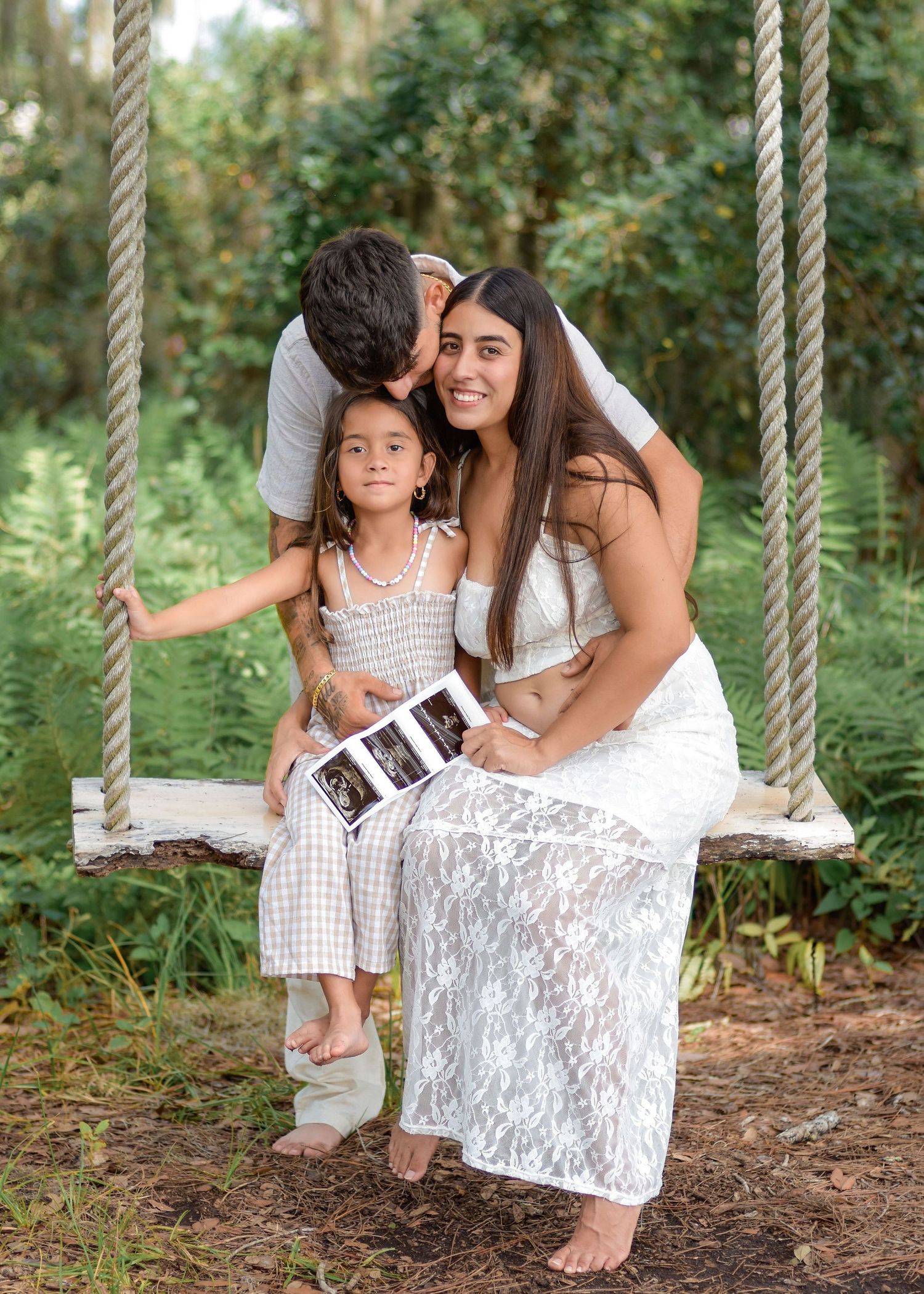 Outdoor pregnancy announcement session in Orlando Florida with a growing family by Orlando photographer Erin Laine Photo