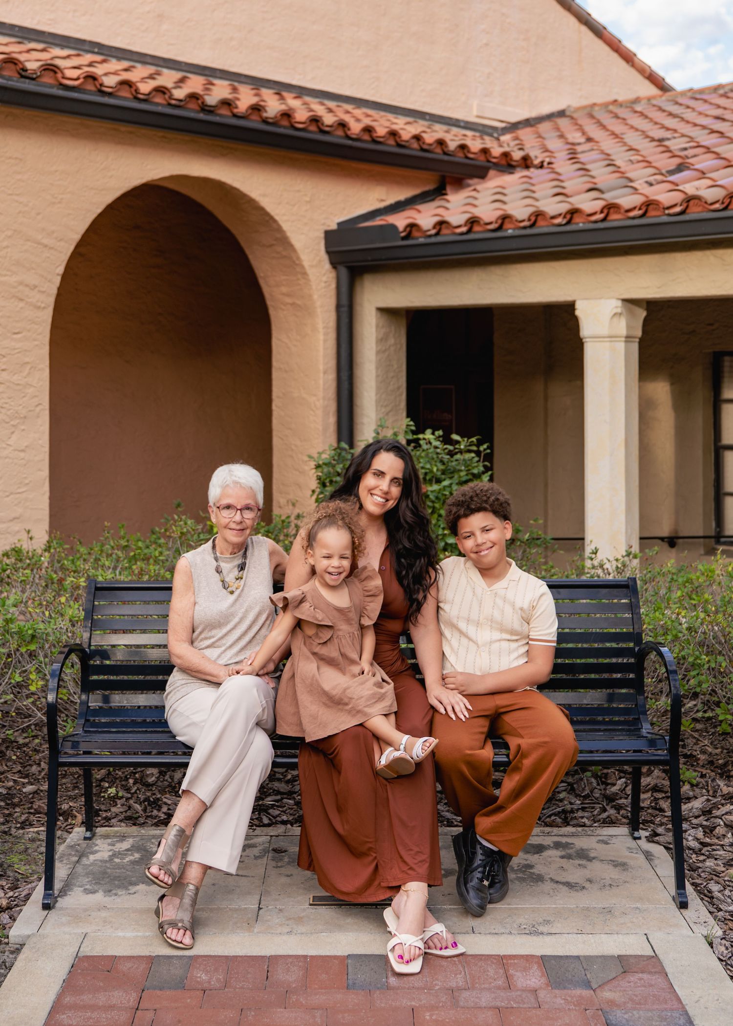 Outdoor family portraits surrounded by the beautiful architecture of Rollins College in Winter Park.