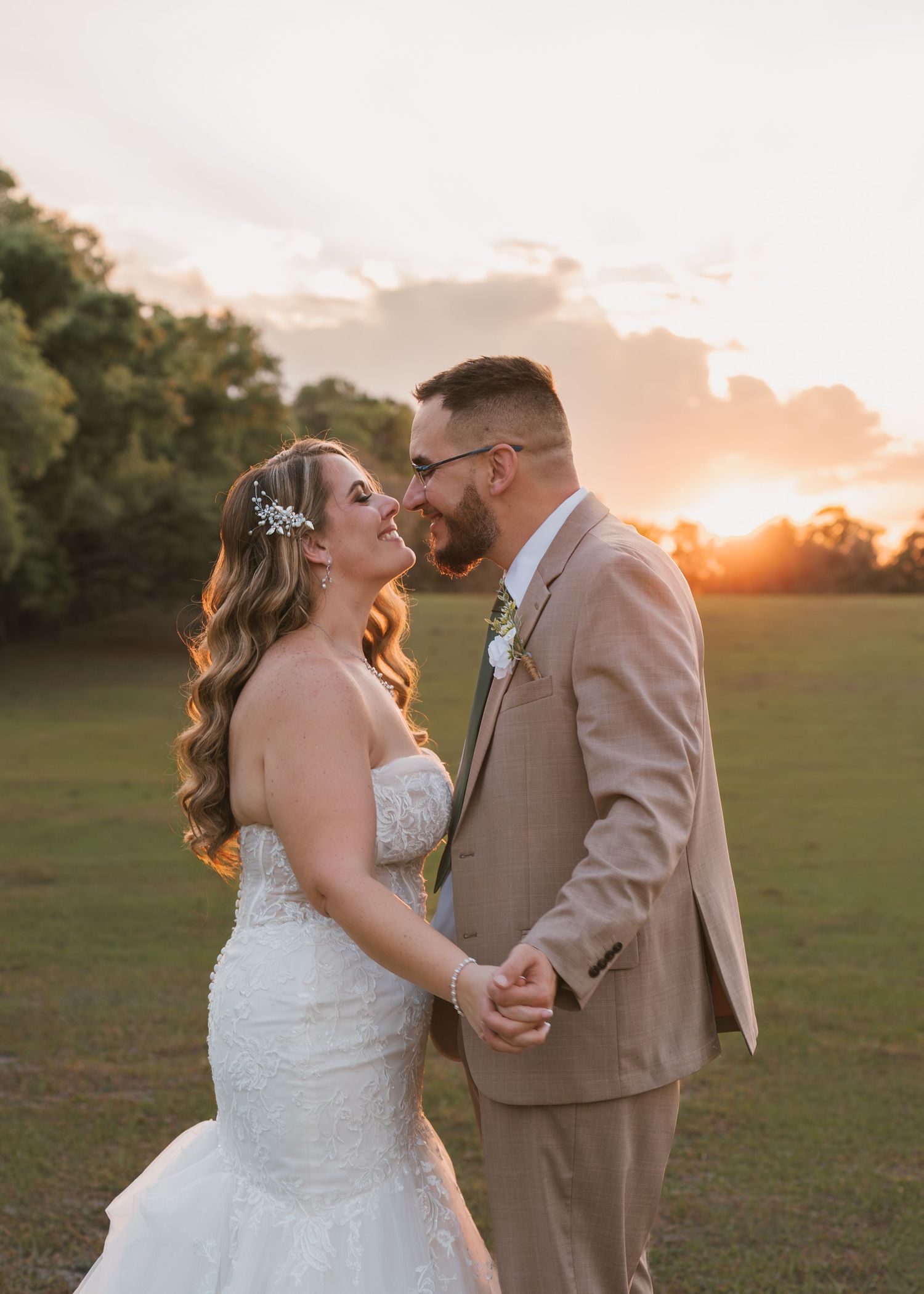 Intimate golden hour wedding portraits in the peaceful open field at Moss Estates wedding venue in Eustis, Florida.