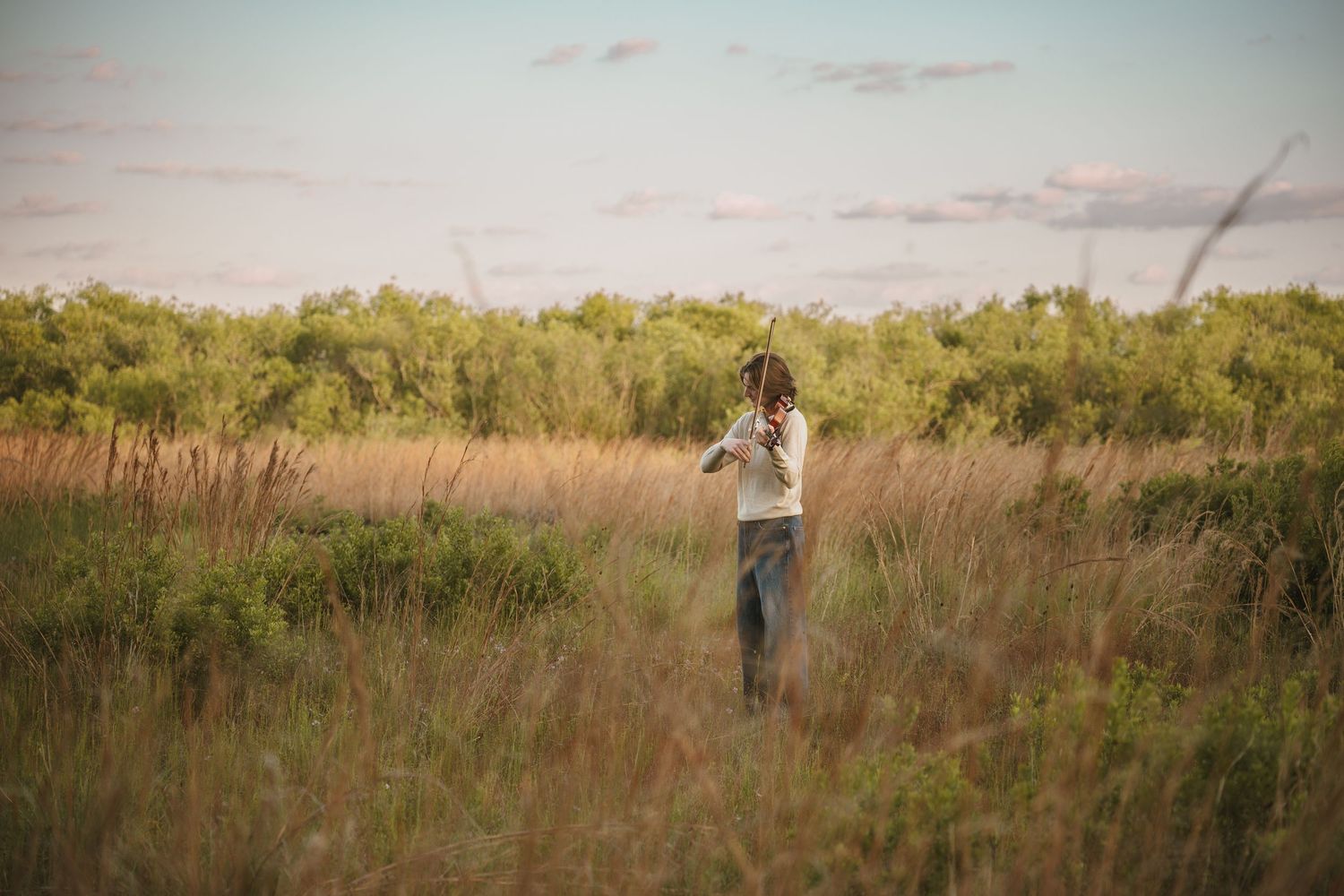 Golden hour graduation photography portraits captured in the open fields of Lake Runnymede Conservation Area St Cloud Florida
