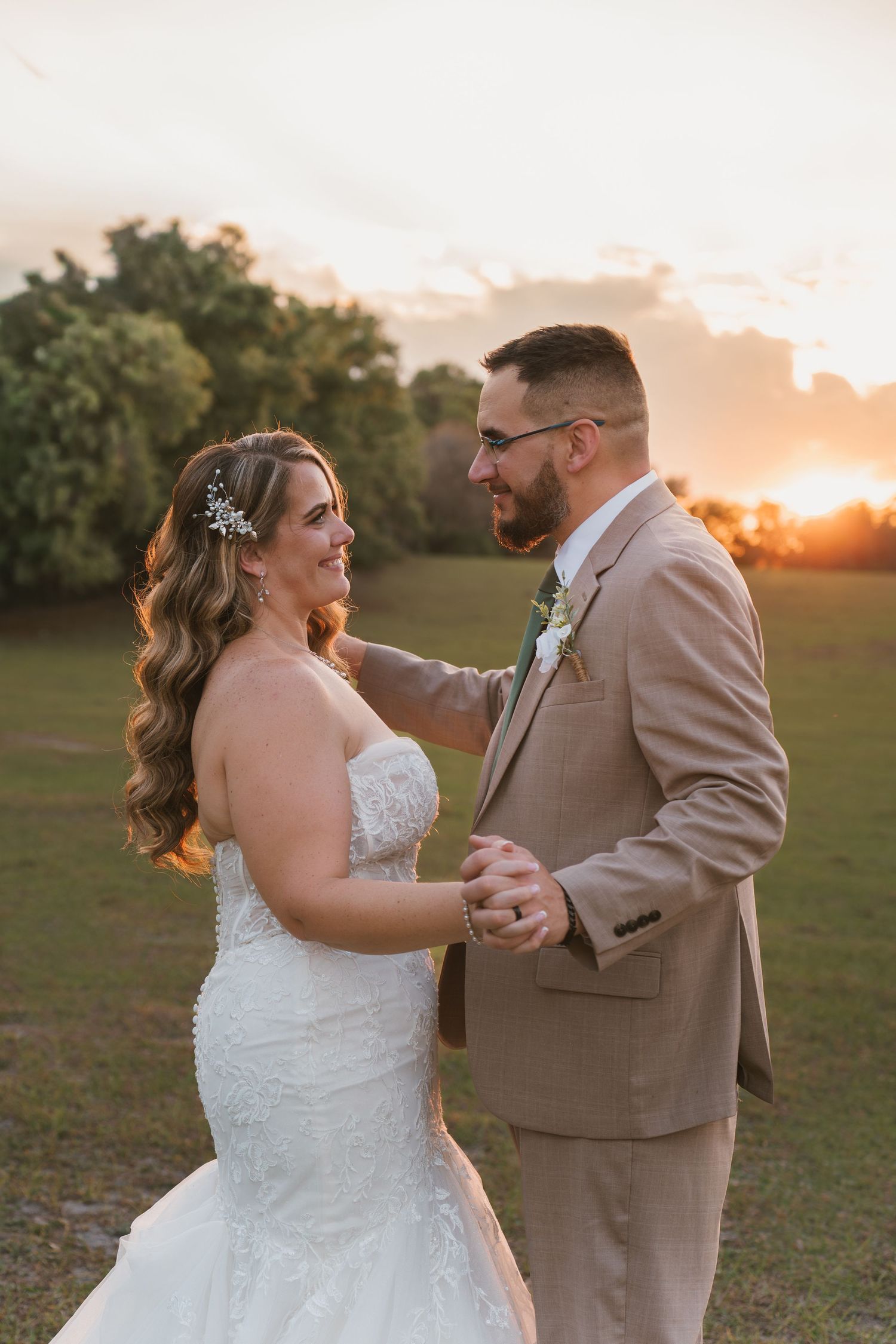 Intimate golden hour wedding portraits in the peaceful open field at Moss Estates wedding venue in Eustis, Florida.