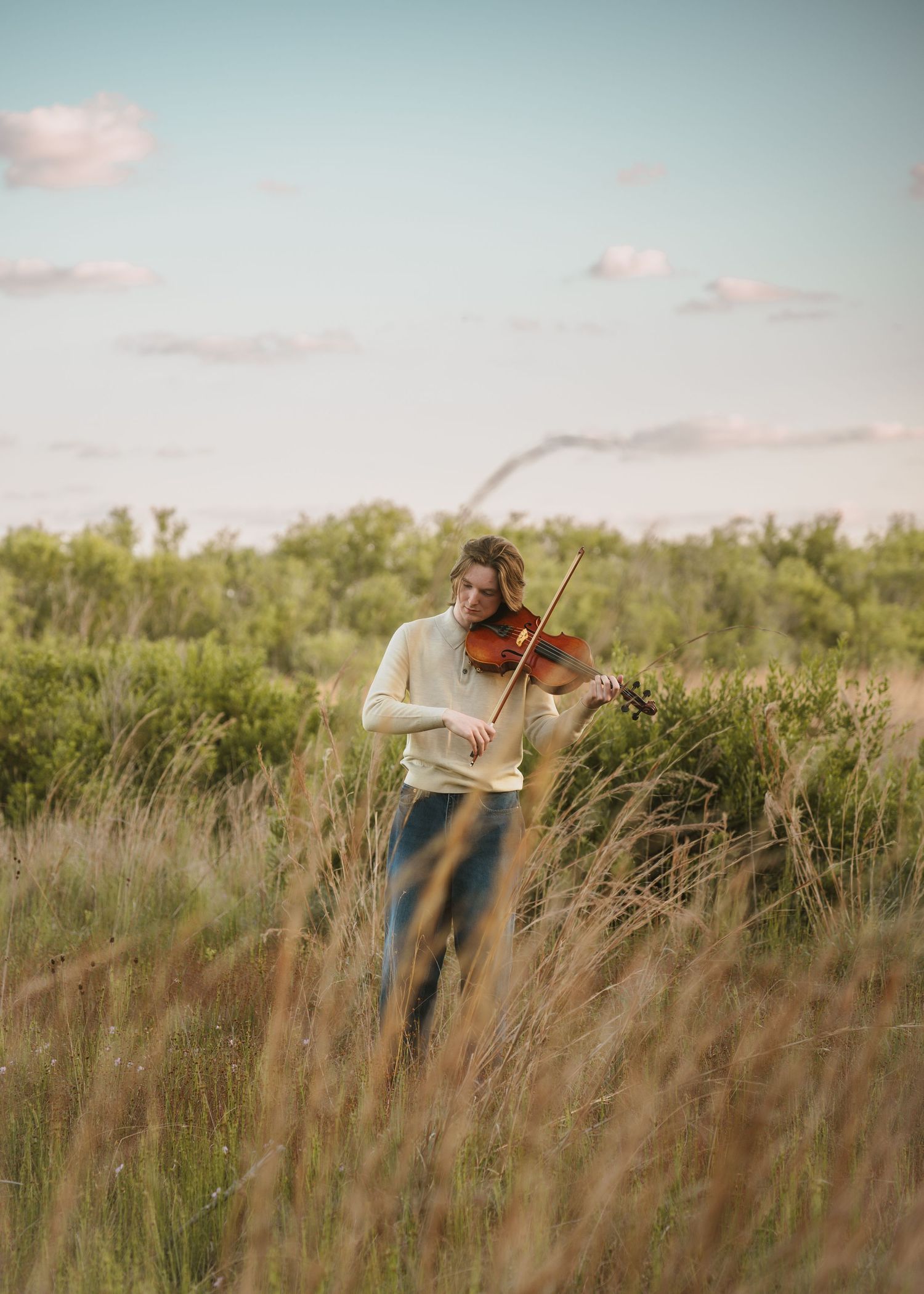 Golden hour graduation photography portraits captured in the open fields of Lake Runnymede Conservation Area St Cloud Florida