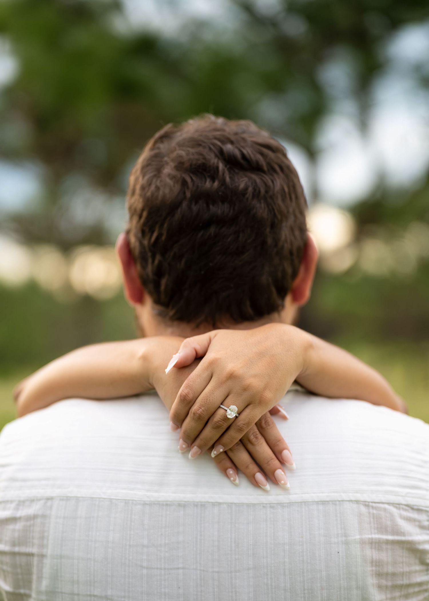 Couple enjoying a romantic engagement session at Lake Louisa State Park