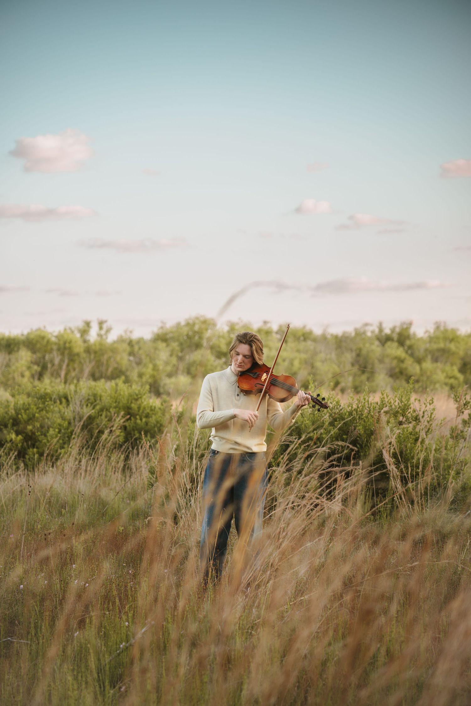 Golden hour graduation photography portraits captured in the open fields of Lake Runnymede Conservation Area St Cloud Florida