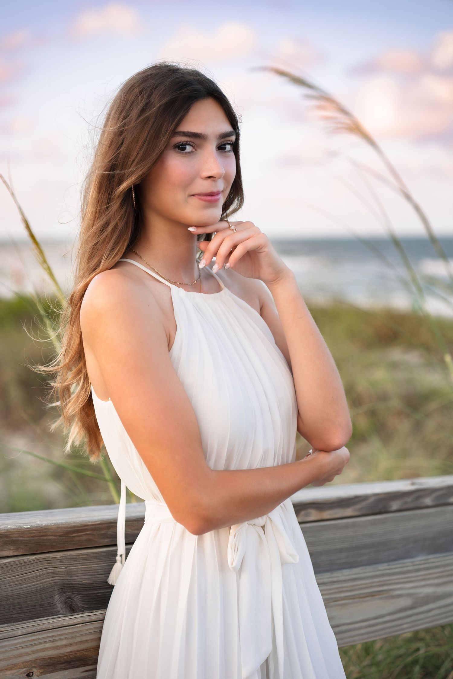 Senior graduation portraits with the beautiful sky at Melbourne Beach, Florida.