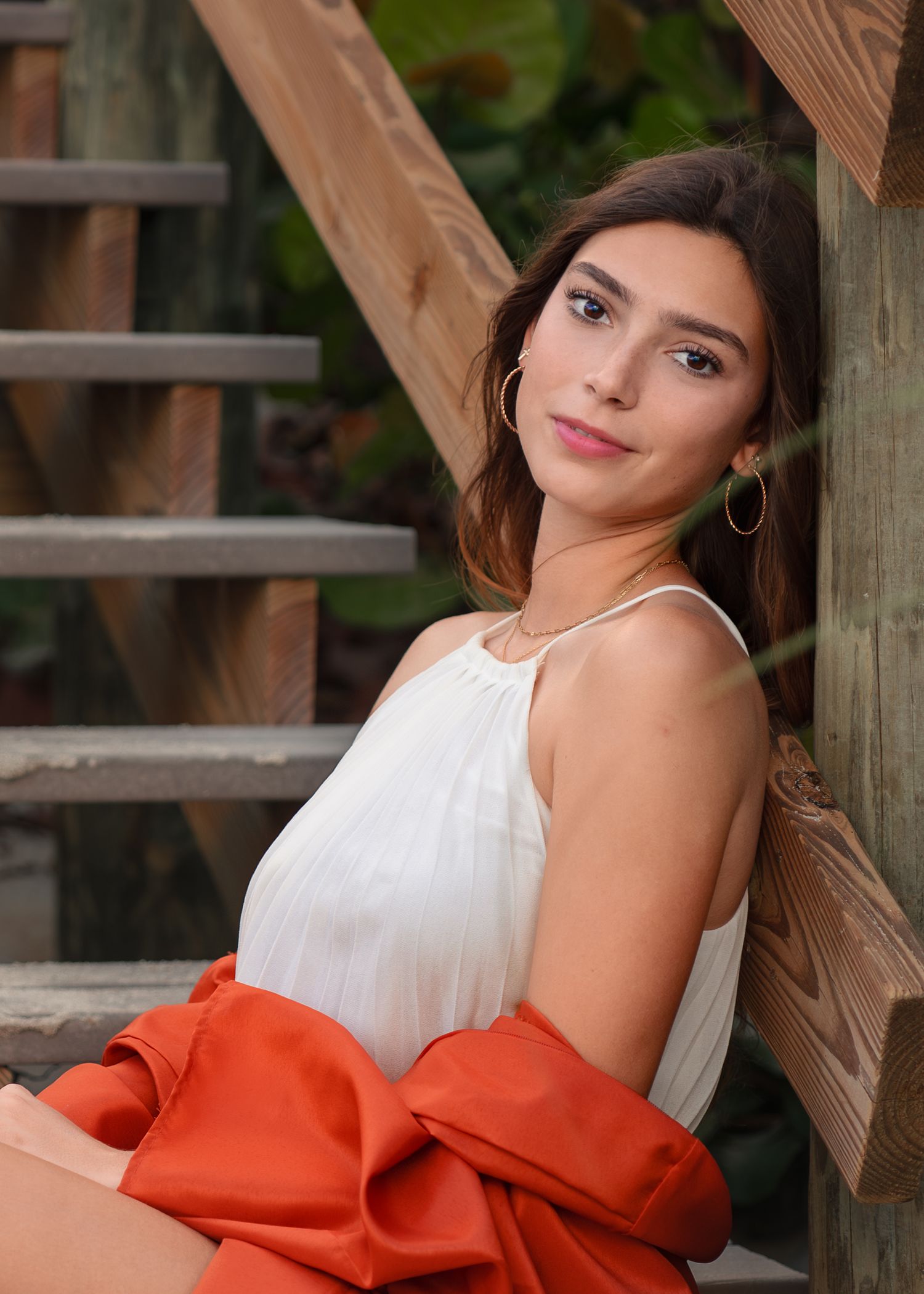 Outdoor graduation portrait photography at Melbourne Beach featuring a graduating senior.