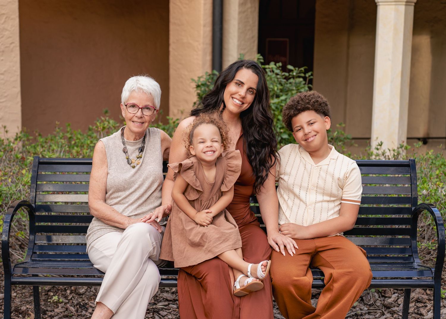 Outdoor family portraits surrounded by the beautiful architecture of Rollins College in Winter Park.
