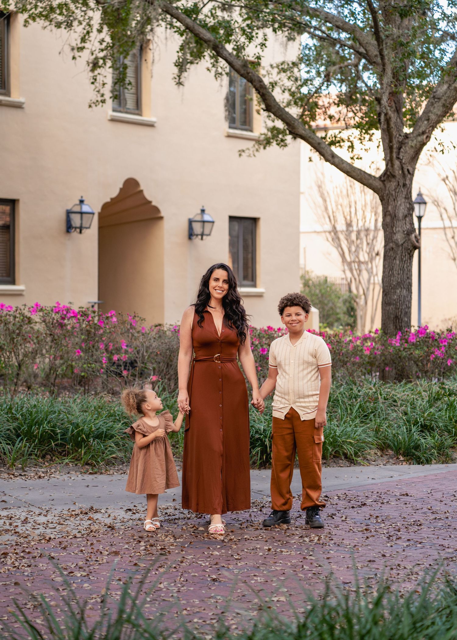 Family portraits framed by the historic Mediterranean architecture of Rollins College in Winter Park.