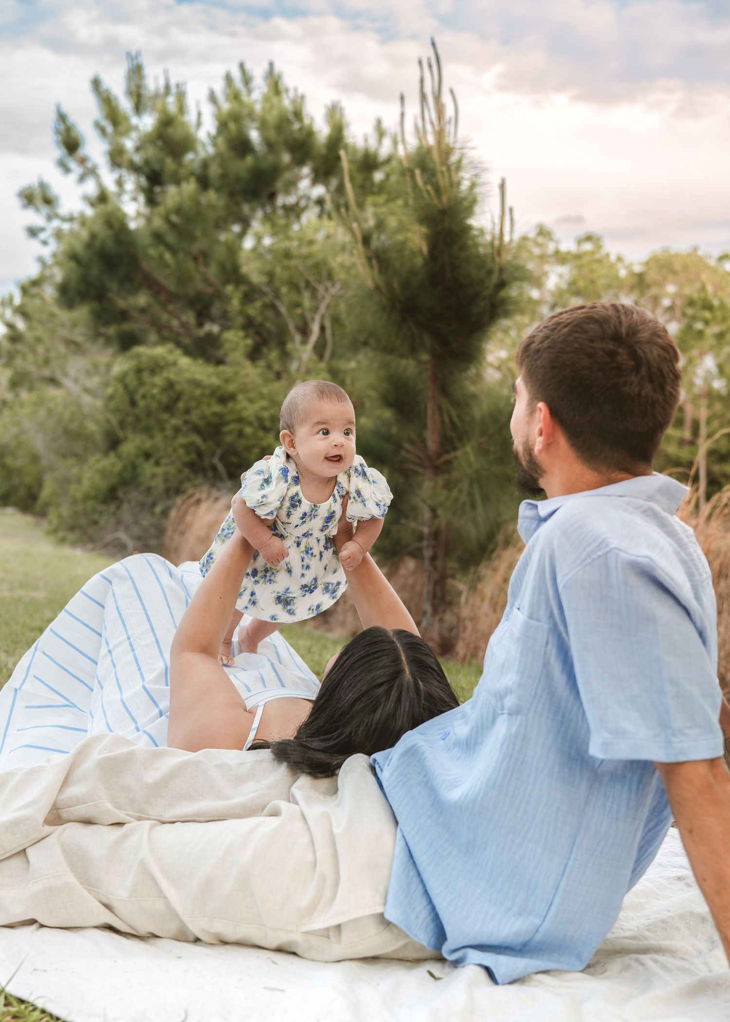 Outdoor picnic family portraits captured in St. Cloud, Florida during a relaxed lifestyle photography session.