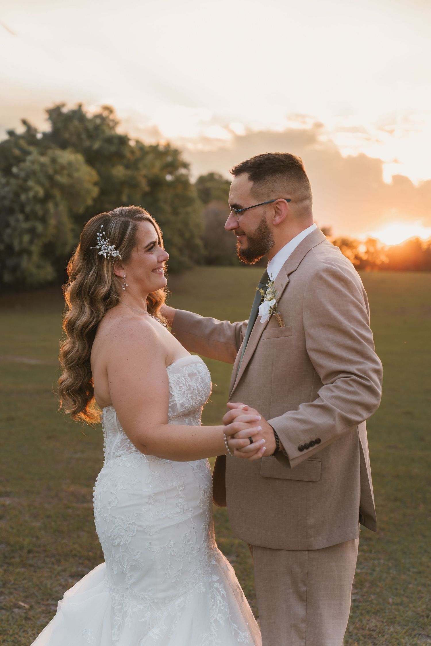 Romantic golden hour wedding portraits in the open field at Moss Estates wedding venue in Eustis, Florida.