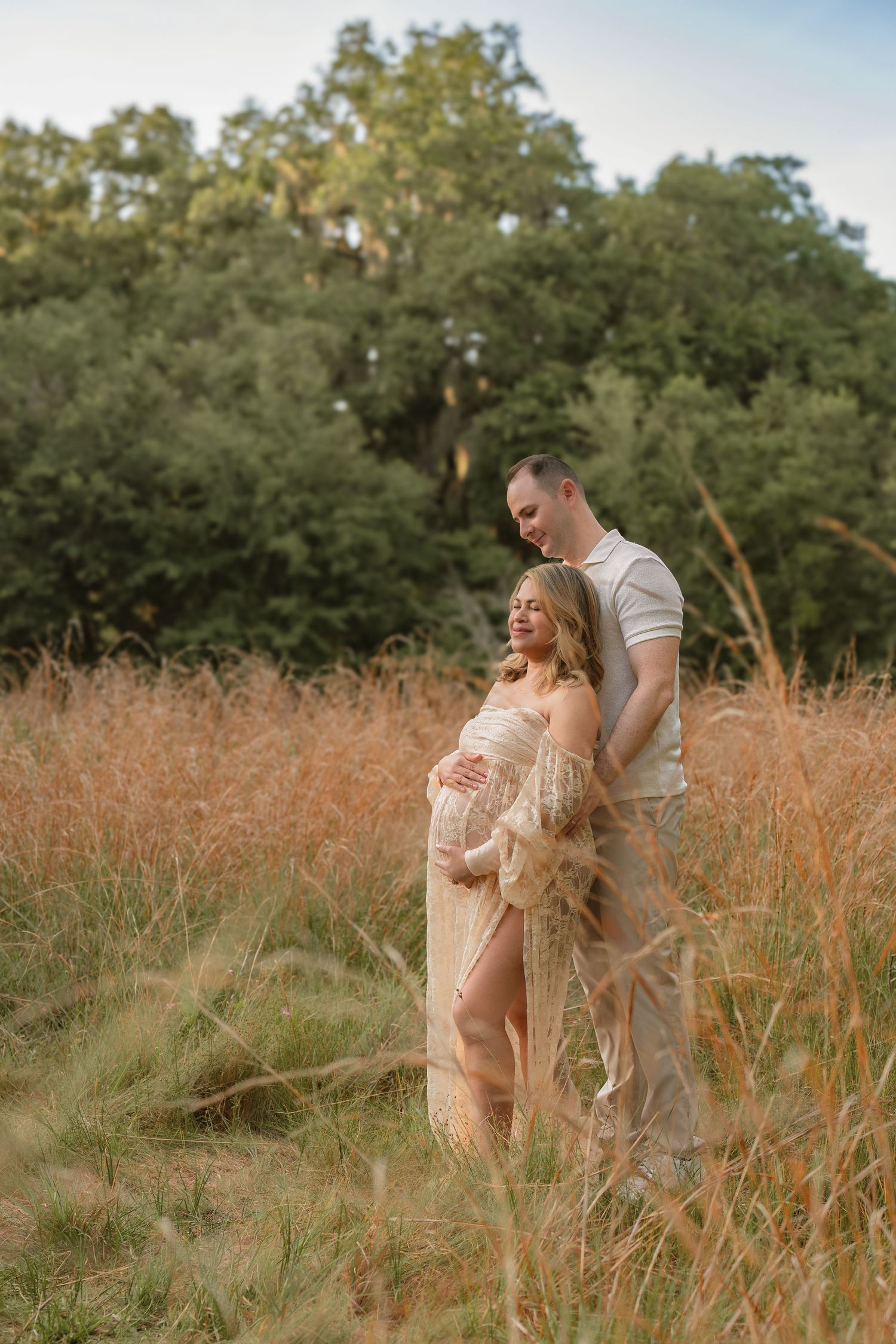 Romantic maternity session featuring an expecting mother and father-to-be at Lake Runnymede Conservation Area in St. Cloud, Florida.