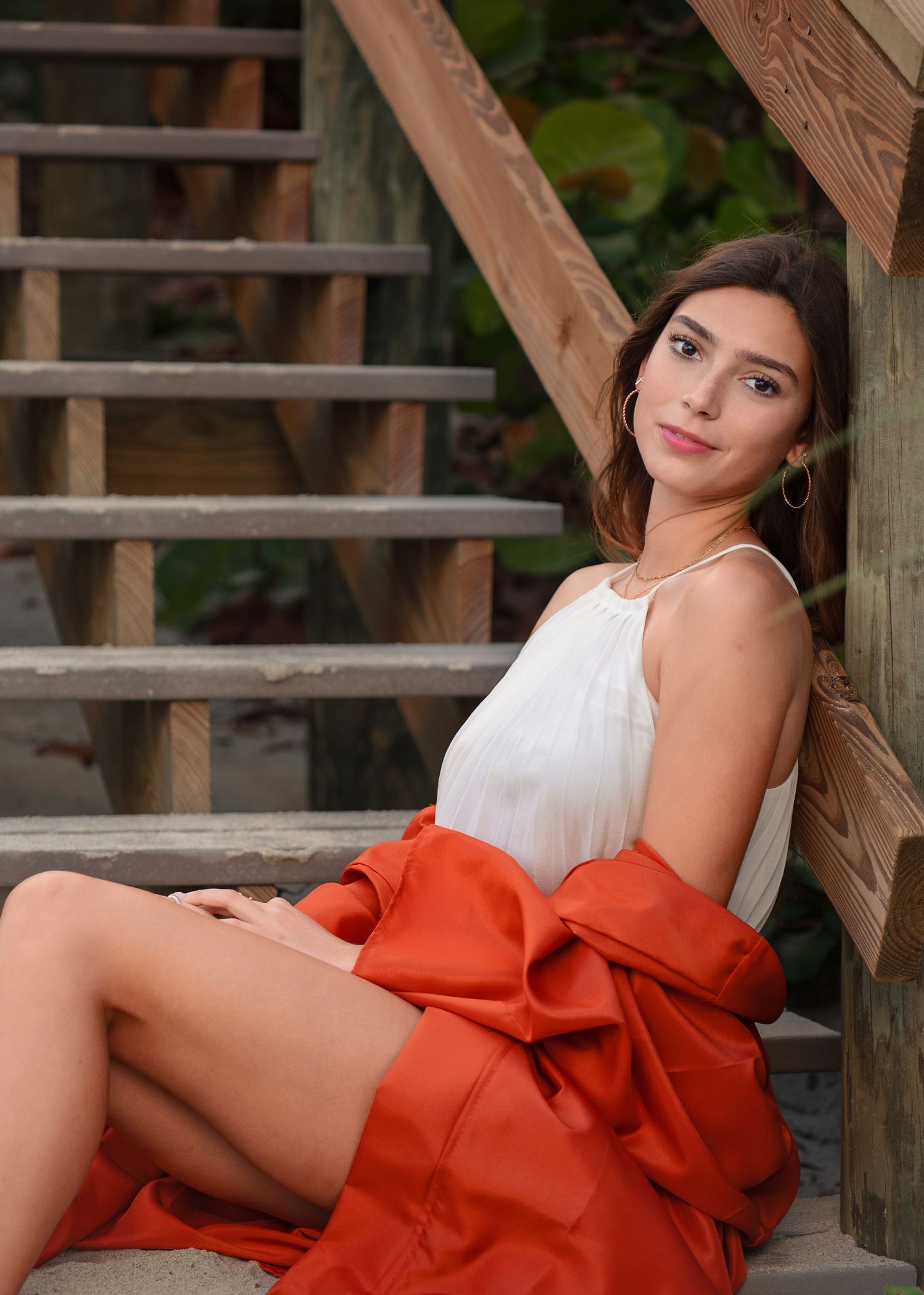Outdoor graduation photography at Melbourne Beach featuring a graduating senior.