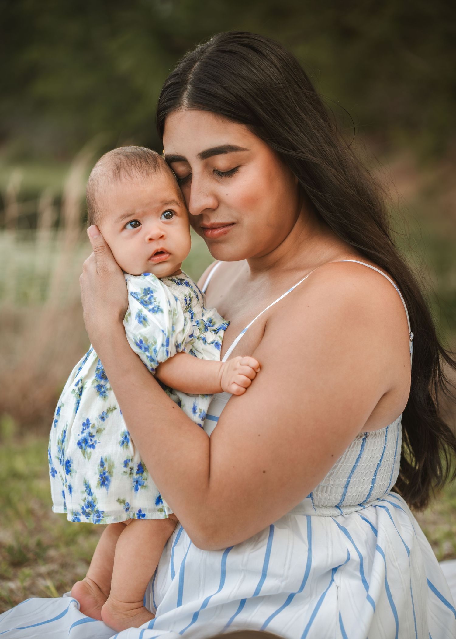 Outdoor boho motherhood photography portraits celebrating genuine family connection in St. Cloud Florida