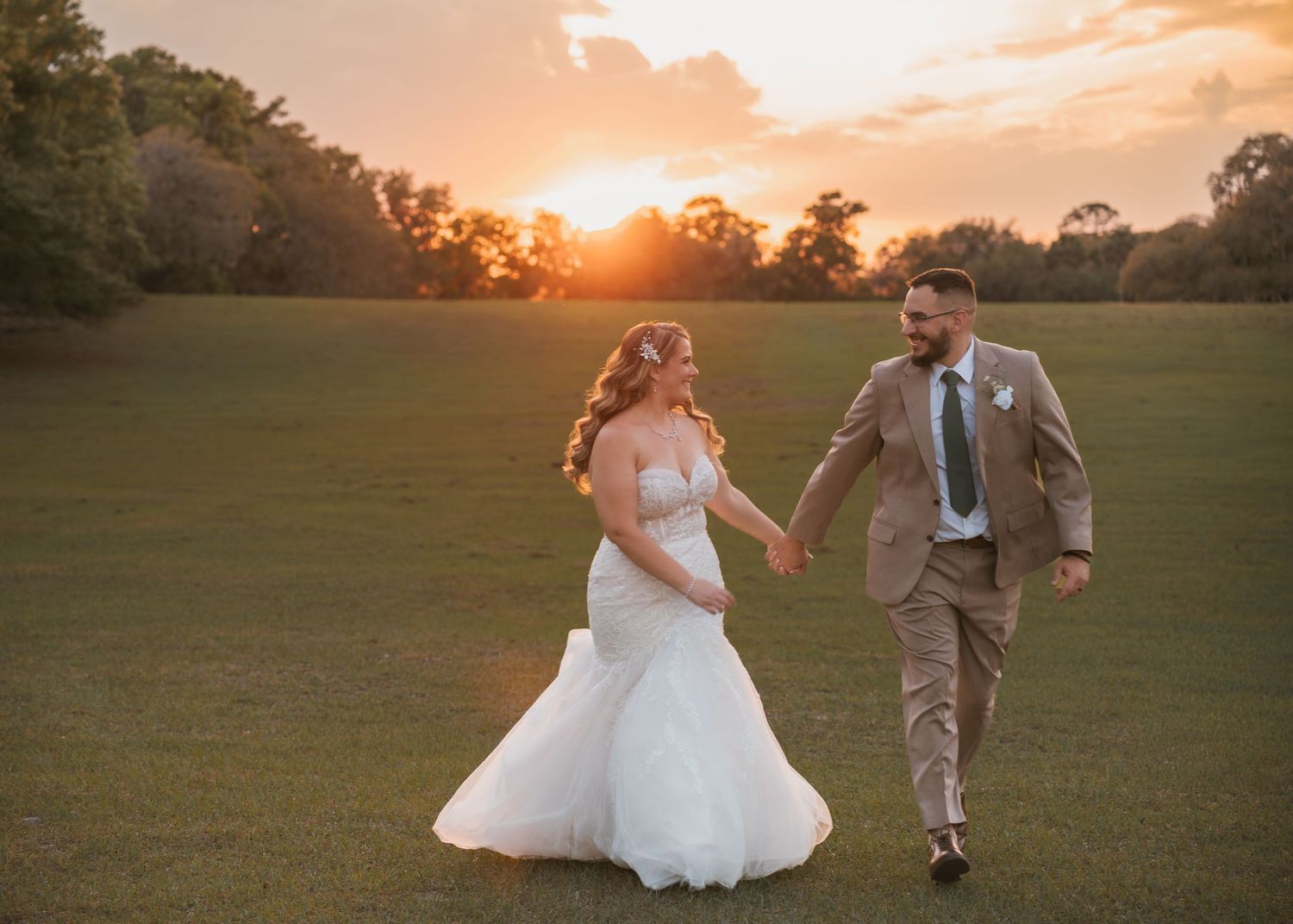 Romantic golden hour wedding portraits in the open field at Moss Estates wedding venue in Eustis, Florida.