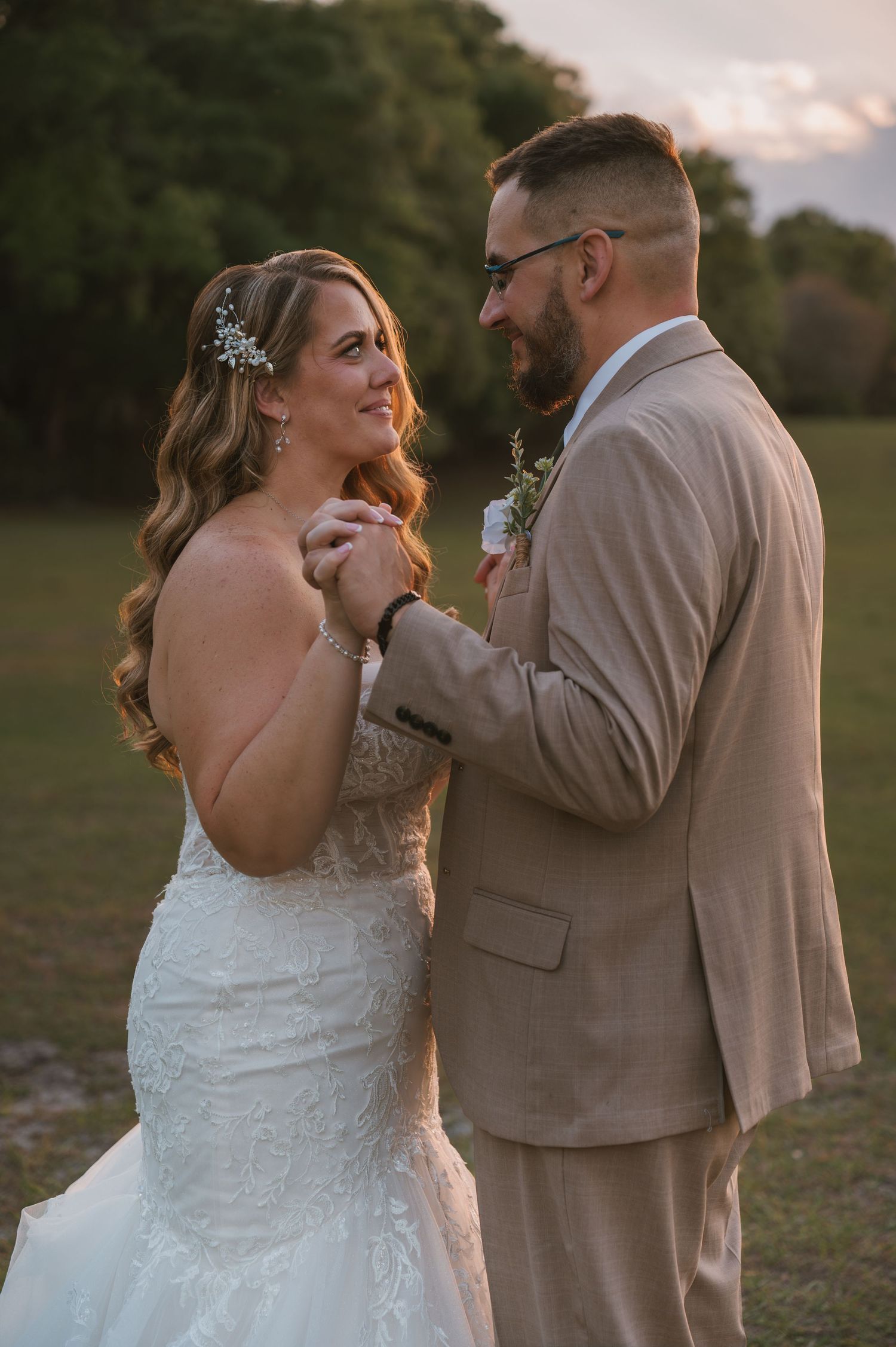 Intimate golden hour wedding portraits in the peaceful open field at Moss Estates wedding venue in Eustis, Florida.