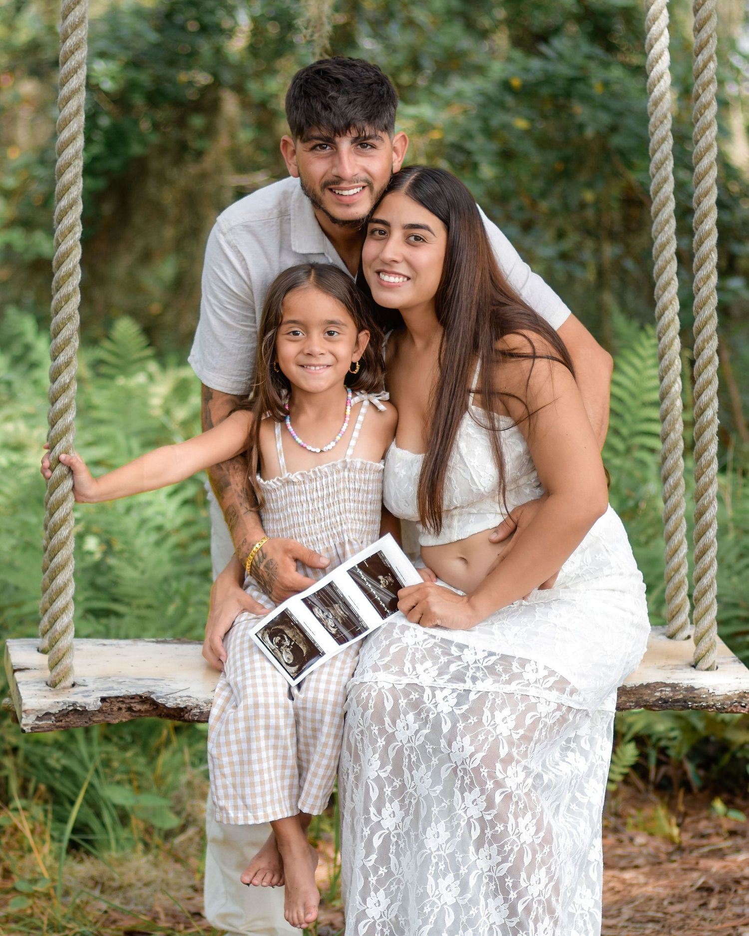 Sweet pregnancy announcement session with parents and daughter in St. Cloud Florida