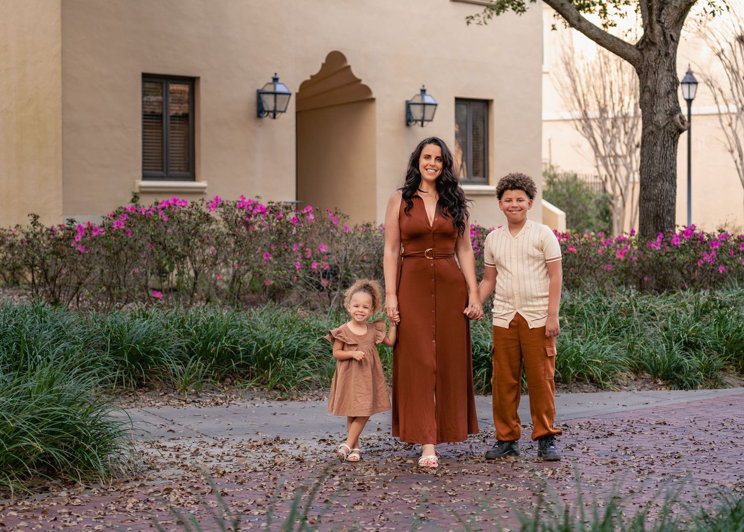 Outdoor family photography captured among the beautiful gardens and architecture of Rollins College in Winter Park Florida.