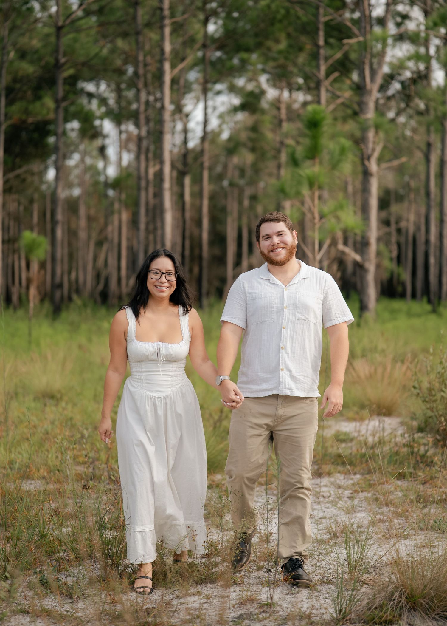 engaged couple surrounded by natural scenery at Lake Louisa State Park