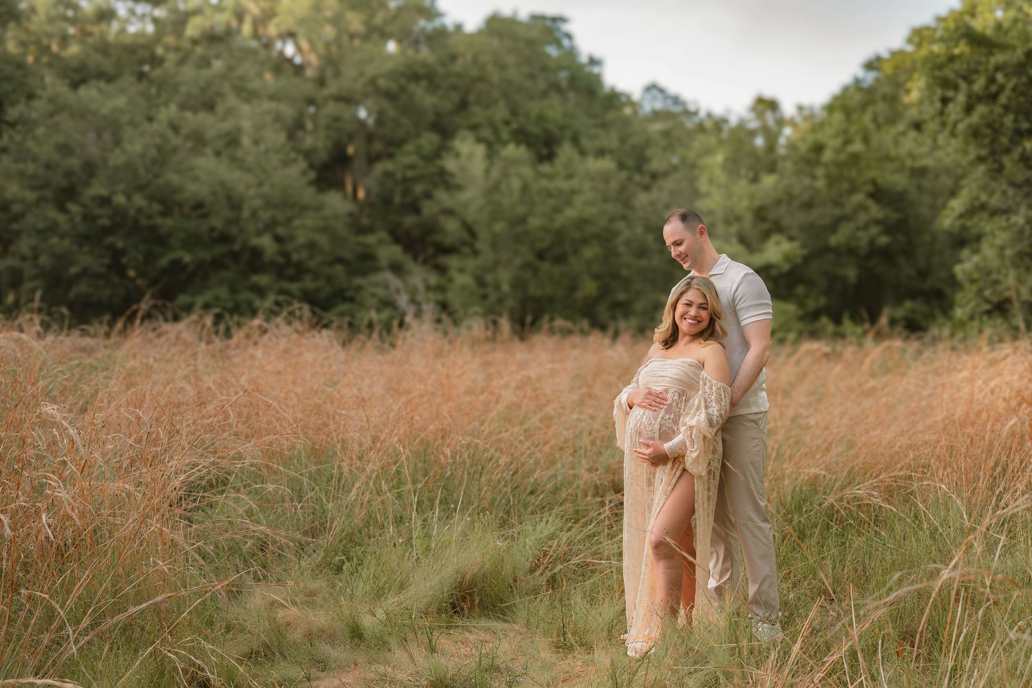 Expecting parents sharing a quiet moment together during their outdoor maternity session at Lake Runnymede Conservation Area.