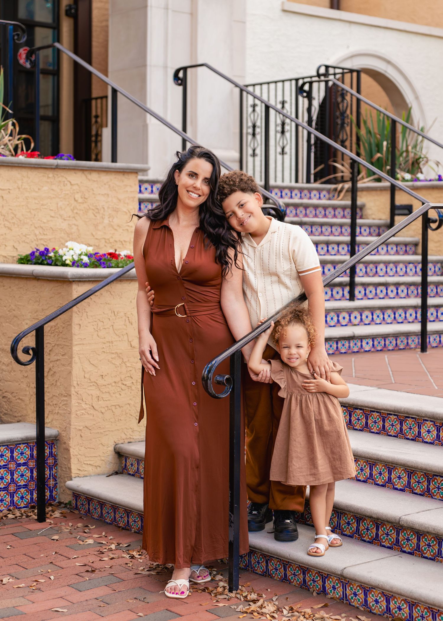Genuine moments between a mother and her children during a family photography session at Rollins College in Winter Park Florida