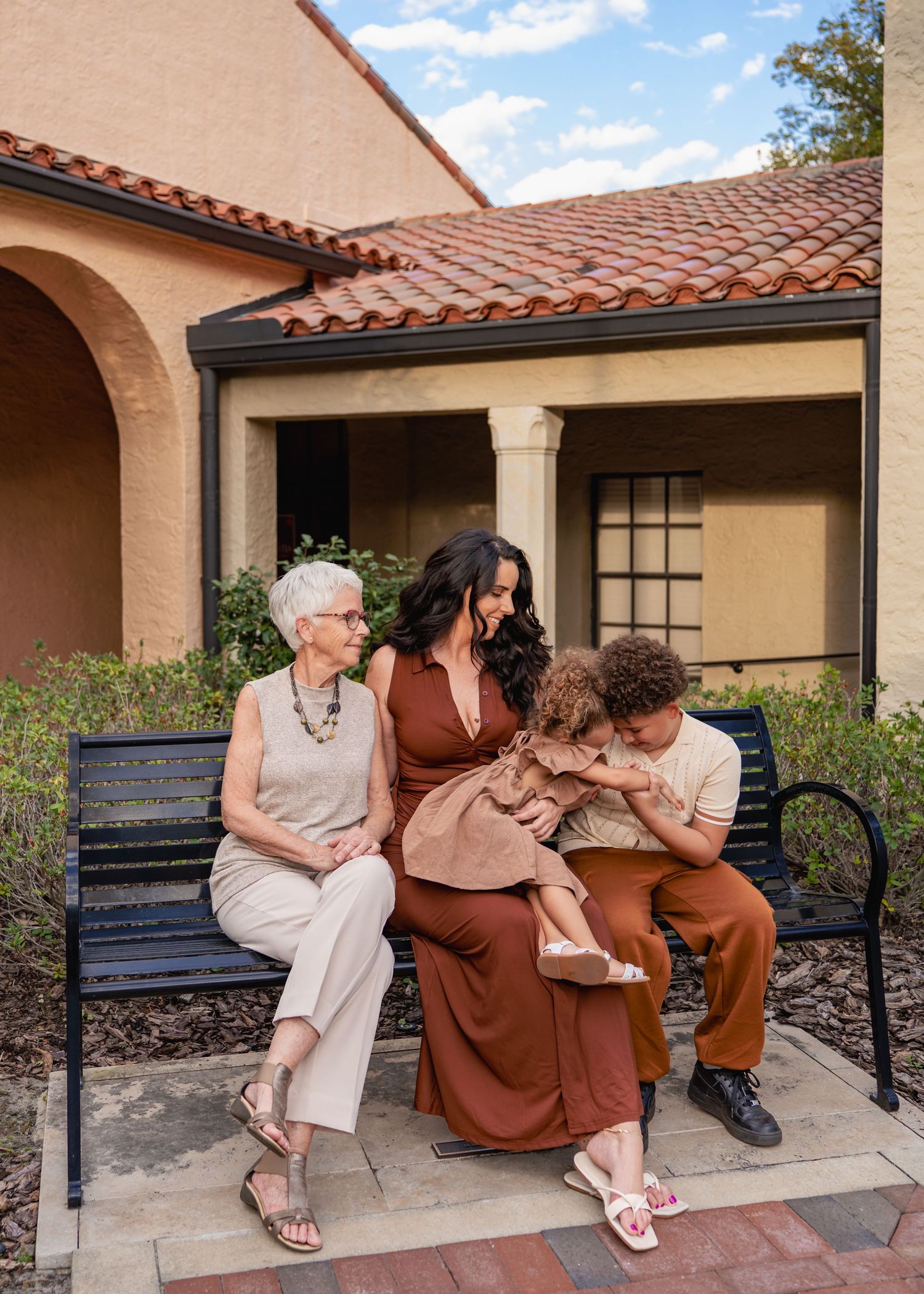 Outdoor family photography captured among the beautiful gardens and architecture of Rollins College.