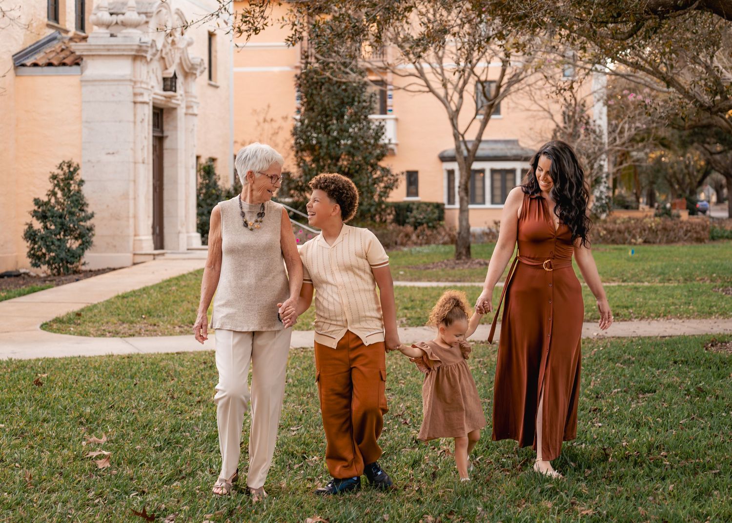 Outdoor family photography captured among the beautiful gardens and architecture of Rollins College in Winter Park Florida