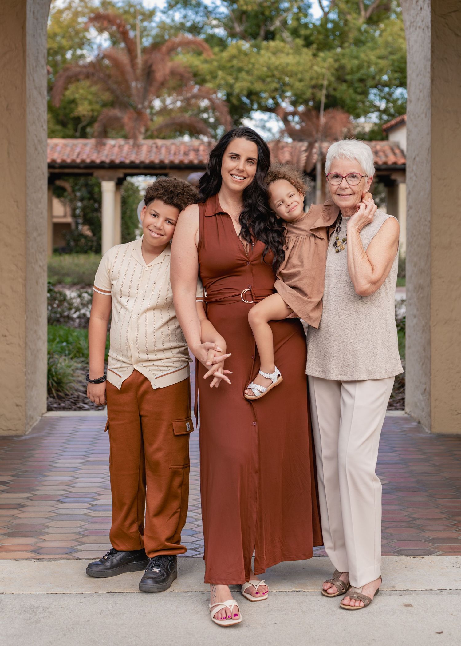 Outdoor family photography captured among the beautiful gardens and architecture of Rollins College.