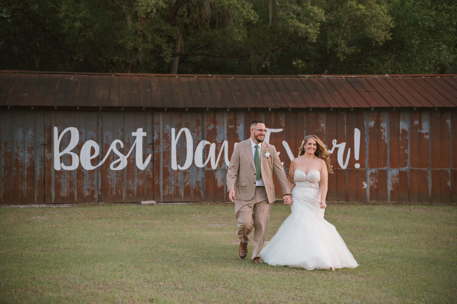 Golden hour portraits highlighting the bride and groom in the scenic fields at Moss Estates wedding venue in Eustis, Florida.