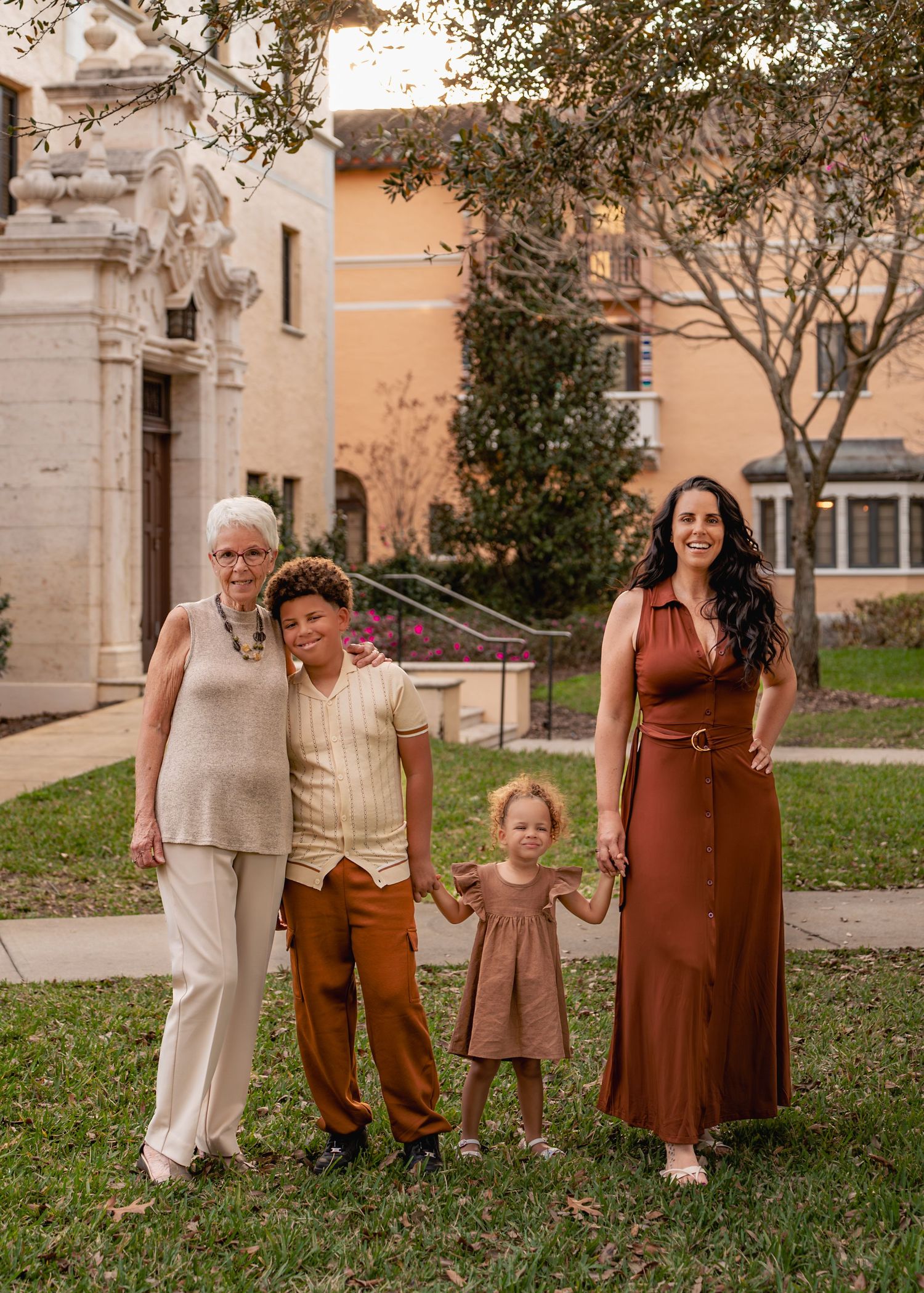 Outdoor family photography captured among the beautiful gardens and architecture of Rollins College in Winter Park Florida.