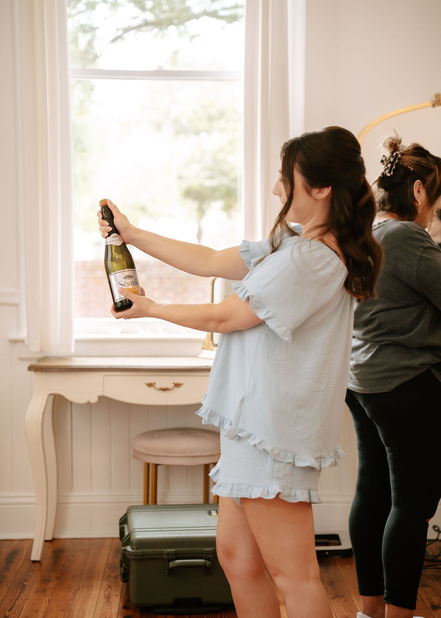 Beautiful bridal suite moments captured as the bride and her bridesmaids prepare for the wedding at Historic Venue 1902.